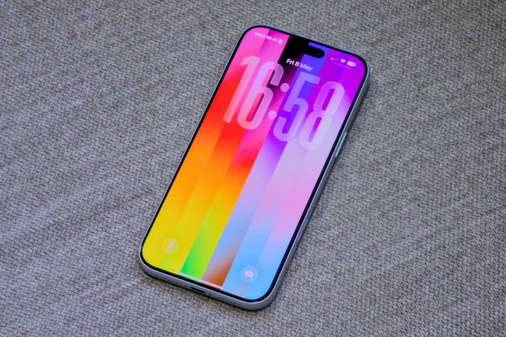 iOS 26 5 Pride wallpaper on an iphone lock screen
