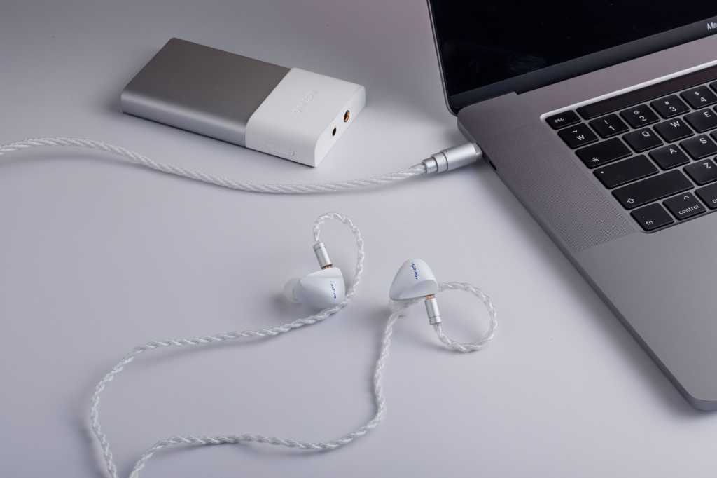 Photo of Scoop earbuds connected to MacBook laptop.
